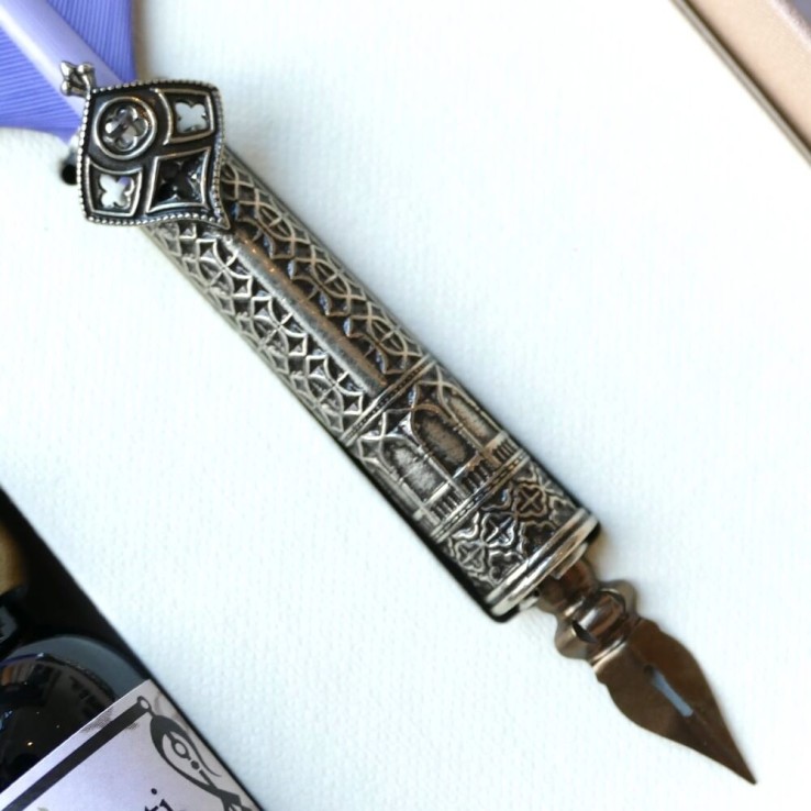Ornate Feather quill pen and ink
