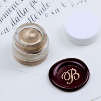 Gold metallic highlight applied to wax seal impression
