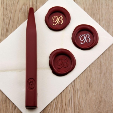 Burgundy red wax seal impression on envelope