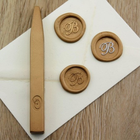 Metallic gold wax seal impression on envelope