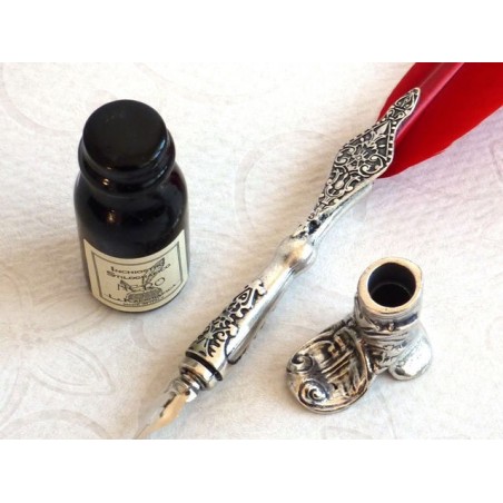 Pluma roja, portabotas y tinta