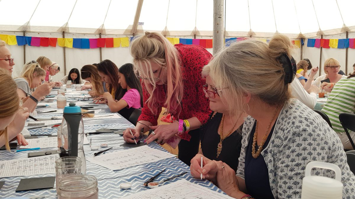 Jane teaching at a calligraphy workshop